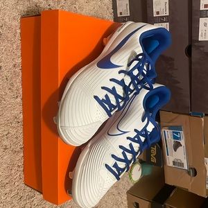 Nike Lunarlon Women’s Softball cleats.  White with blue trim.  Size 9.5.